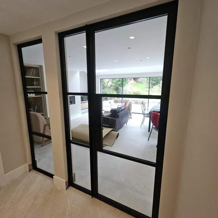 A living room filled with furniture and a sliding glass door.